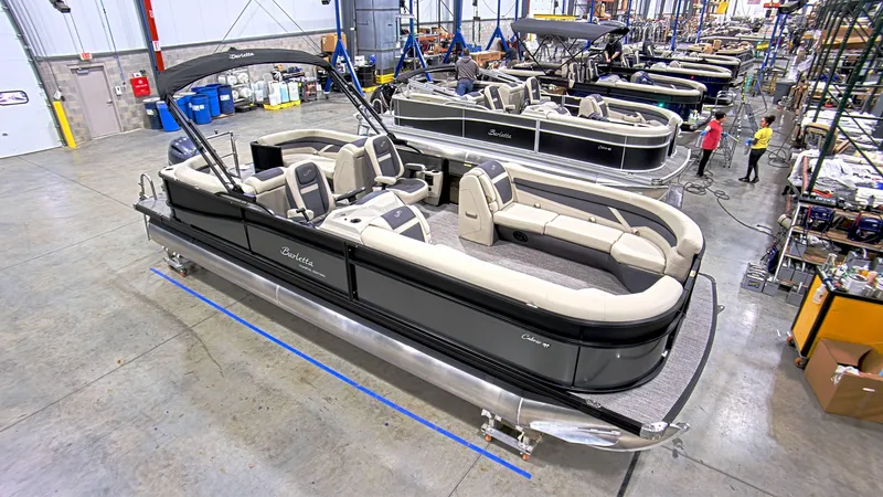 Slide: The Image of 2023 Barletta C24QC pontoon boat in a manufacturing facility. - 4