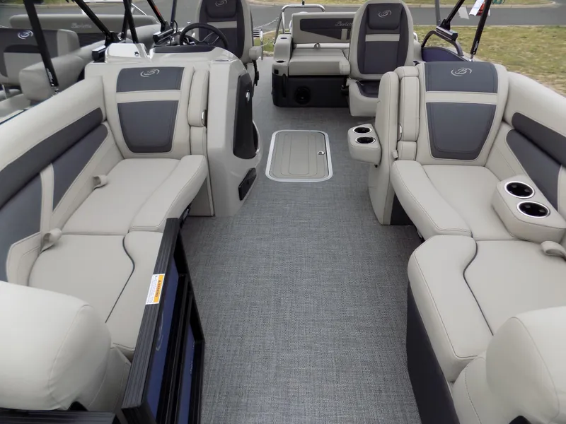 Slide: The Image of 2023 Barletta C20UC pontoon boat interior with gray seating and modern design. - 5