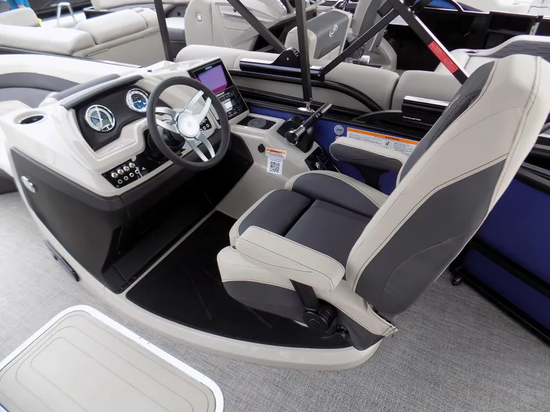Slide: The Image of 2023 Barletta C20UC boat interior with modern dashboard and comfortable seating. - 6