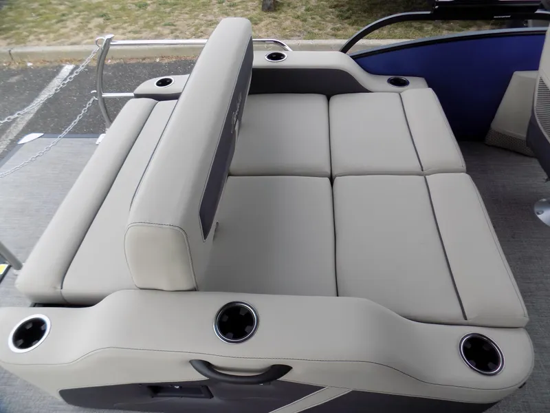 Slide: The Image of 2023 Barletta C20UC boat seating with cup holders, featuring beige upholstery and modern design. - 7