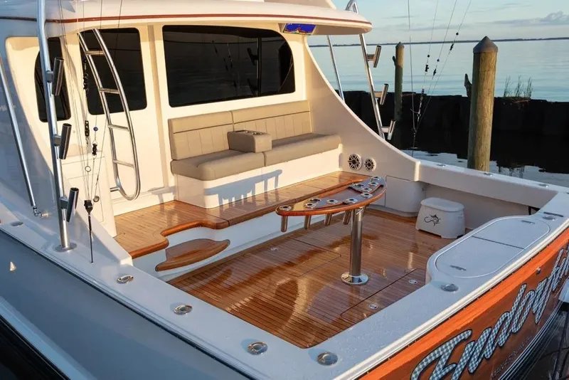 Slide: The Image of 2026 Albemarle 53 Spencer yacht with teak deck and fishing setup at dock. - 14