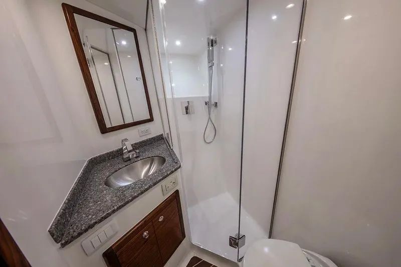 Slide: The Image of Luxurious bathroom in 2026 Albemarle 53 Spencer yacht with modern fixtures and sleek design. - 9