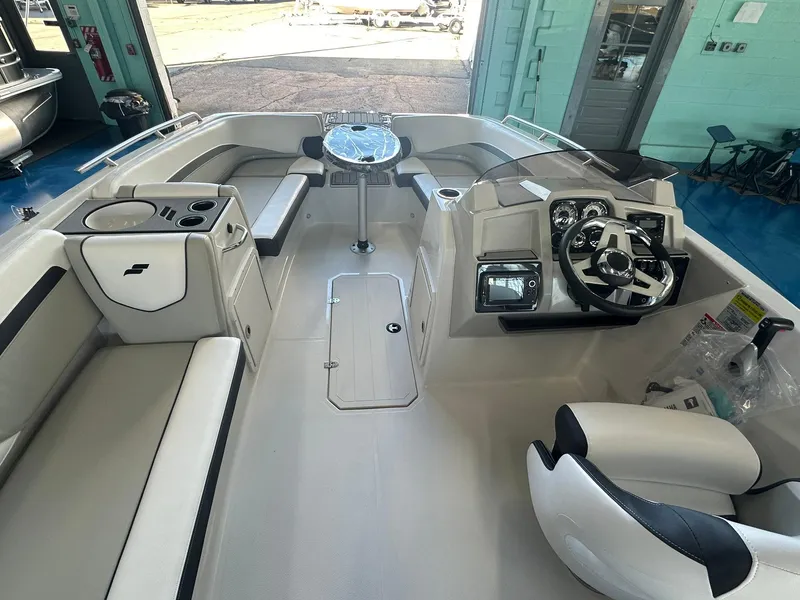 Slide: The Image of 2026 Starcraft SVX 191 OB boat cockpit with steering wheel and modern controls. - 12