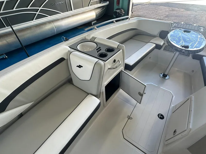 Slide: The Image of Captain's seat and steering wheel of 2026 Starcraft SVX 191 OB boat interior. - 13