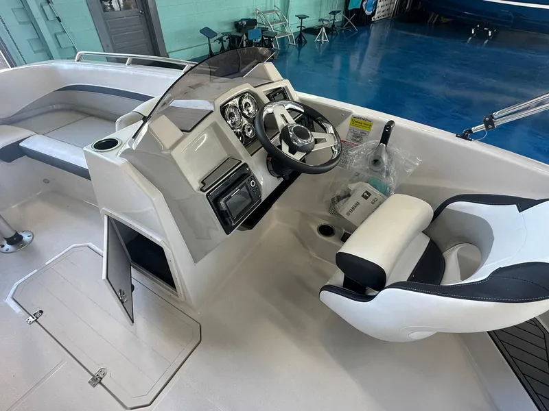 Slide: The Image of 2026 Starcraft SVX 191 OB dashboard with steering wheel, gauges, and control panel. - 15