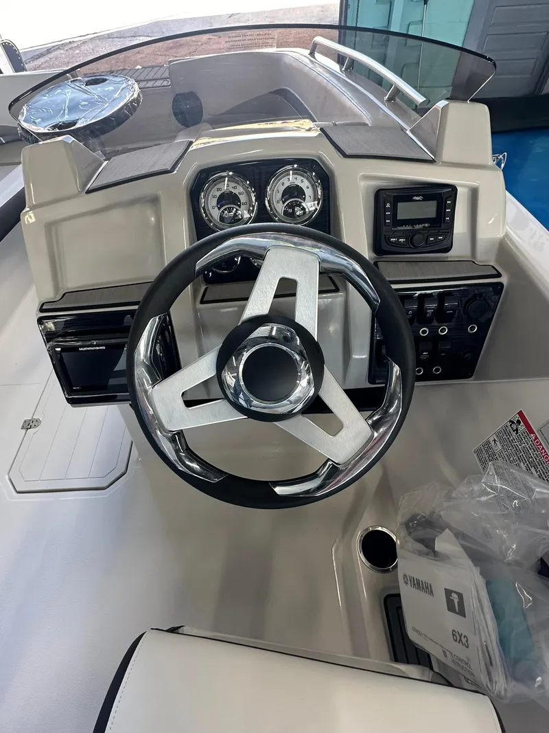 Slide: The Image of Dashboard of 2026 Starcraft SVX 191 OB with Wet Sounds audio system. - 16