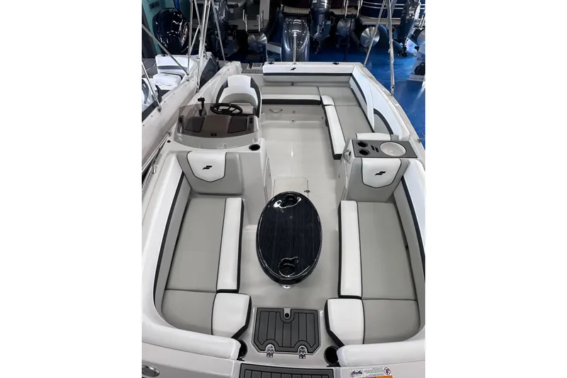 Slide: The Image of 2026 Starcraft SVX 191 OB boat interior with seating and steering console. - 31