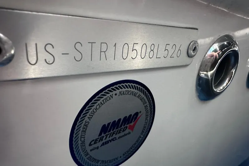 Slide: The Image of 2026 Starcraft SVX 191 OB boat with hull identification number and NMMA certification sticker. - 33