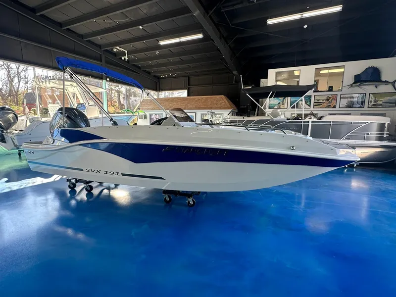Slide: The Image of 2026 Starcraft SVX 191 OB boat with 150 HP outboard motor in showroom. - 5