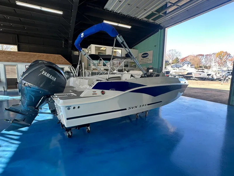 Slide: The Image of 2026 Starcraft SVX 191 OB boat with outboard motor and boarding ladder. - 6
