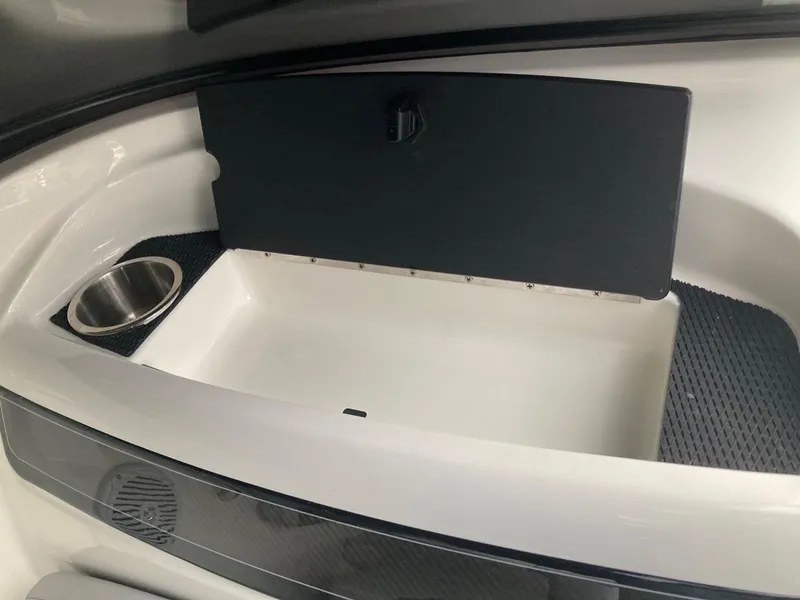 Slide: The Image of 2024 Bayliner VR5 boat storage compartment with cup holder. - 4