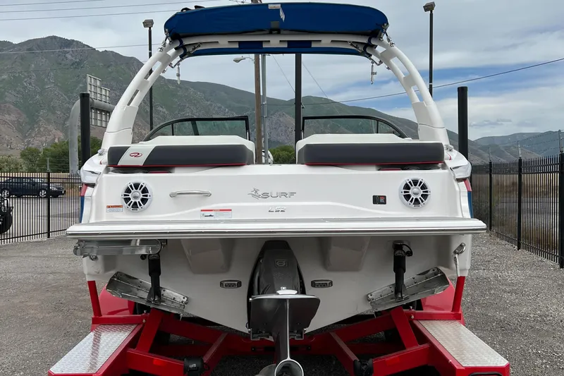 Slide: The Image of 2022 Regal LS2 Surf boat rear view on red trailer. - 7