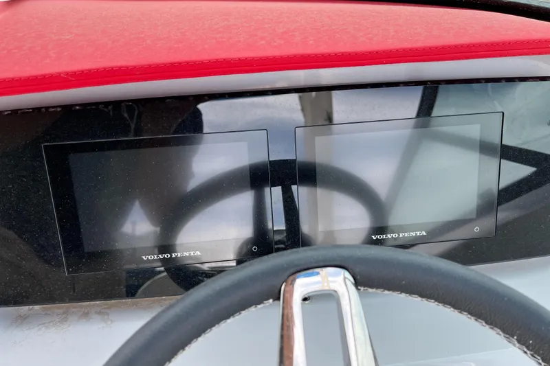 Slide: The Image of 2022 Regal LS2 Surf boat dashboard with dual Volvo Penta displays. - 9