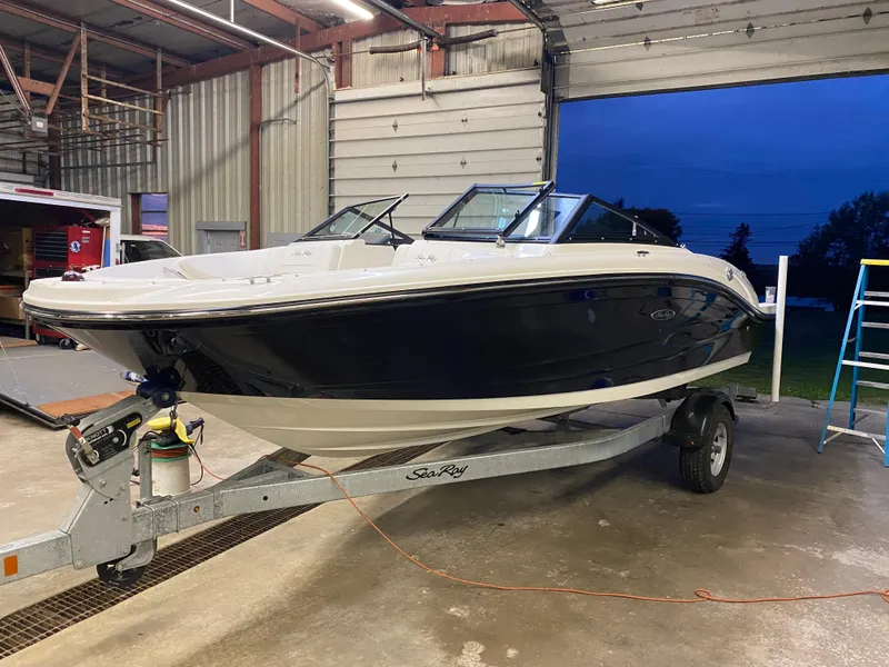 Slide: The Image of 2019 Sea Ray 190 SPX BR boat on a trailer in a garage. - 1