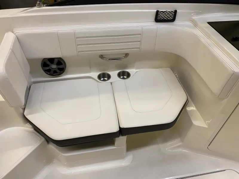 Slide: The Image of 2019 Sea Ray 190 SPX BR boat interior seating with cup holders and speaker. - 12