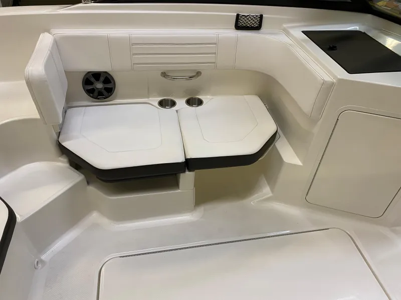Slide: The Image of 2019 Sea Ray 190 SPX BR boat interior seating area with cup holders and speaker. - 16