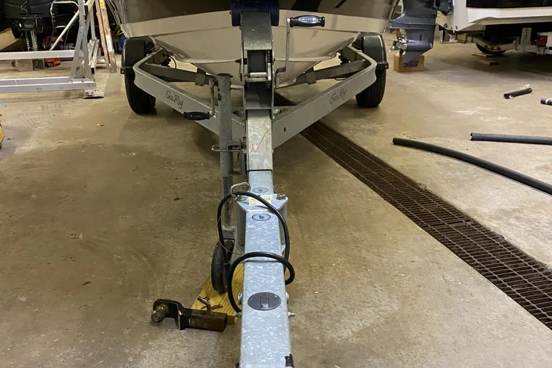 Slide: The Image of 2019 Sea Ray 190 SPX BR boat on trailer in a garage. - 23