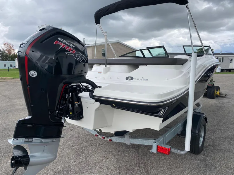 Slide: The Image of 2019 Sea Ray 190 SPX BR boat with Mercury outboard engine on trailer. - 5