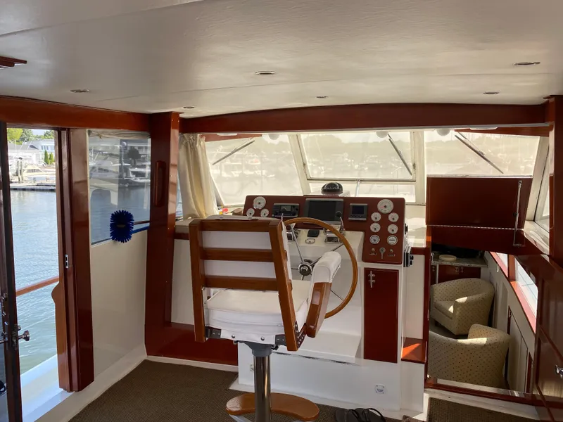 Slide: The Image of 1973 Chris-Craft 47 Commander Flush Deck helm with panoramic windows and captain's chair. - 15