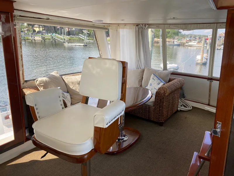 Slide: The Image of Interior of 1973 Chris-Craft 47 Commander Flush Deck yacht with waterfront view. - 16
