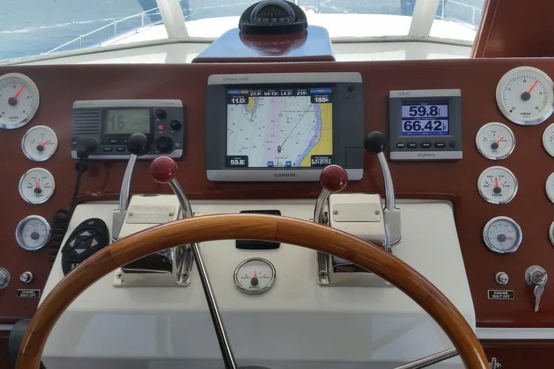 Slide: The Image of Helm of 1973 Chris-Craft 47 Commander Flush Deck with navigation instruments. - 18