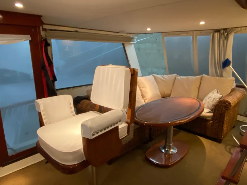 Slide: The Image of Interior of 1973 Chris-Craft 47 Commander Flush Deck with seating and table. - 20