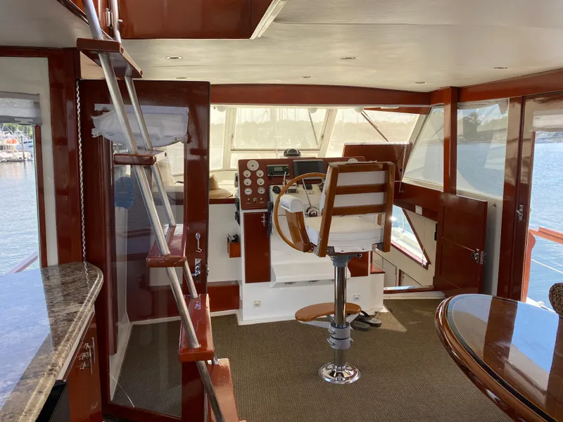Slide: The Image of 1973 Chris-Craft 47 Commander Flush Deck interior with helm station and seating. - 22