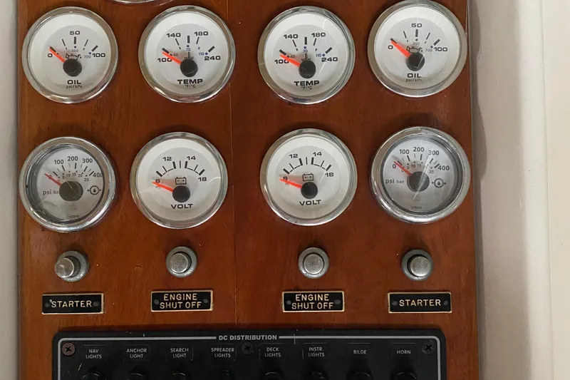 Slide: The Image of 1973 Chris-Craft 47 Commander Flush Deck control panel with gauges and switches. - 40