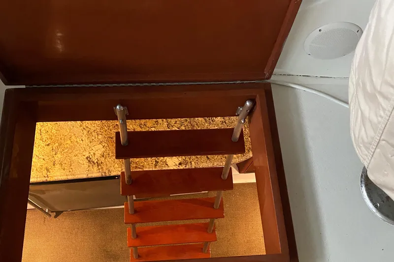 Slide: The Image of Wooden ladder leading to the cabin interior of a 1973 Chris-Craft 47 Commander Flush Deck. - 42