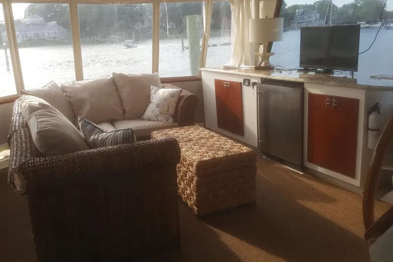 Slide: The Image of Interior of 1973 Chris-Craft 47 Commander Flush Deck yacht with cozy seating area. - 45