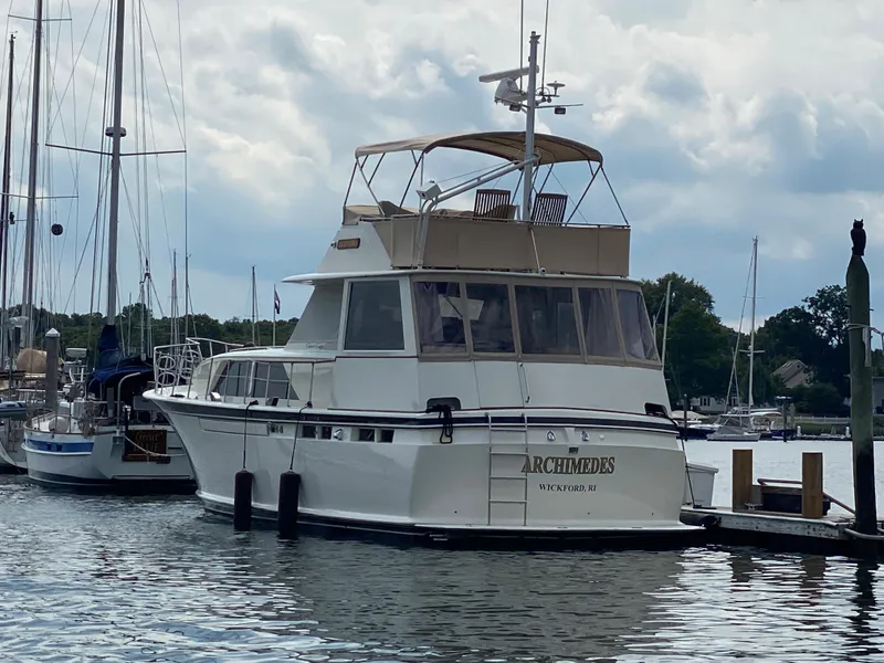 Slide: The Image of 1973 Chris-Craft 47 Commander Flush Deck yacht docked at marina. - 6