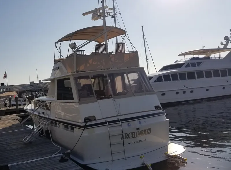 Slide: The Image of 1973 Chris-Craft 47 Commander Flush Deck yacht docked at marina. - 8