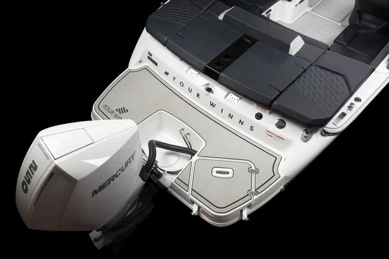 Slide: The Image of 2023 Four Winns H2 OB boat with Mercury outboard motor, rear deck view. - 34