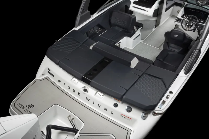 Slide: The Image of 2023 Four Winns H2 OB boat interior with black seating and modern design. - 36