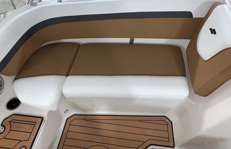 Slide: The Image of 2024 Starcraft SVX 191 boat interior with brown and white seating. - 10