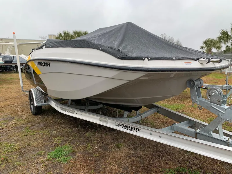 Slide: The Image of 2024 Starcraft SVX 191 boat on trailer with cover. - 2