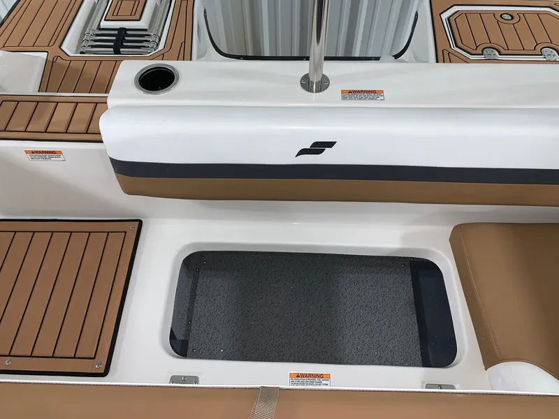 Slide: The Image of 2024 Starcraft SVX 191 boat interior with storage compartment and seating. - 5