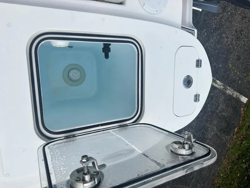 Slide: The Image of Open storage compartment on a 2022 Sea Fox 248 Commander boat. - 12