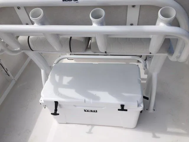 Slide: The Image of 2022 Sea Fox 248 Commander boat with rod holders and Yeti cooler. - 17