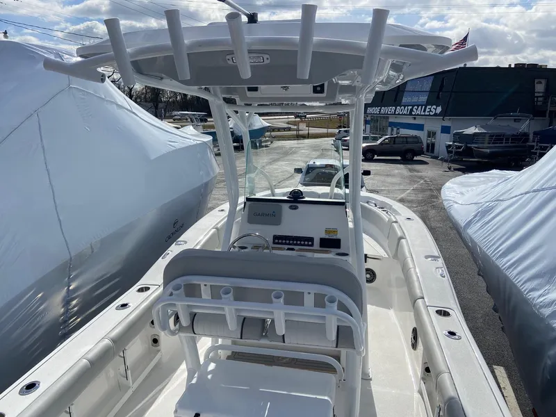 Slide: The Image of 2022 Sea Fox 248 Commander boat with T-top and console, displayed at a boat sales lot. - 18