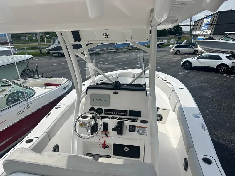 Slide: The Image of 2022 Sea Fox 248 Commander boat interior with steering wheel and Garmin system. - 20