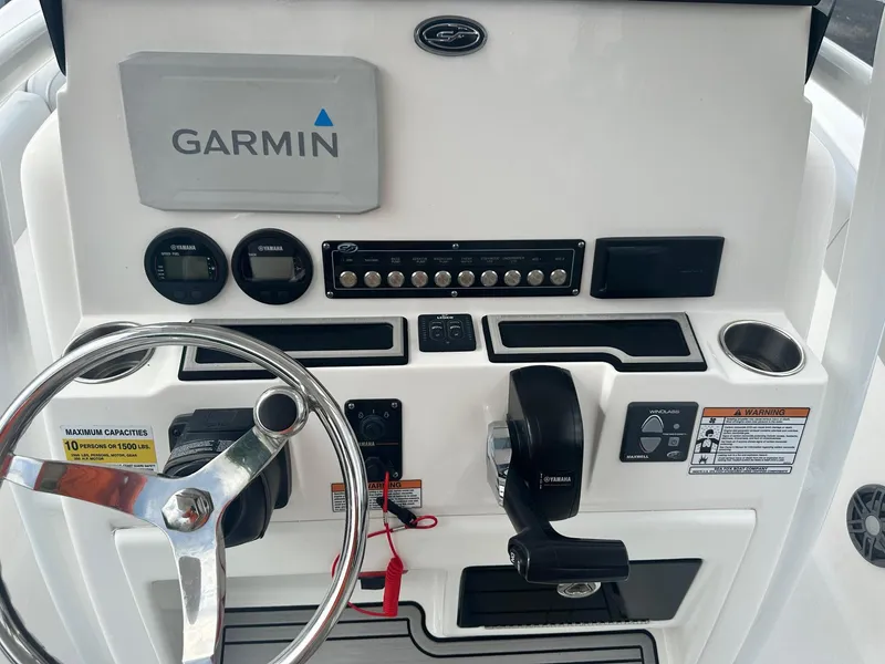 Slide: The Image of 2022 Sea Fox 248 Commander dashboard with Garmin navigation and control panel. - 22