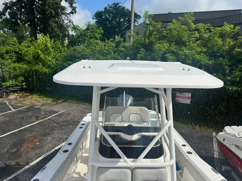 Slide: The Image of 2022 Sea Fox 248 Commander boat with T-top, parked outdoors. - 25