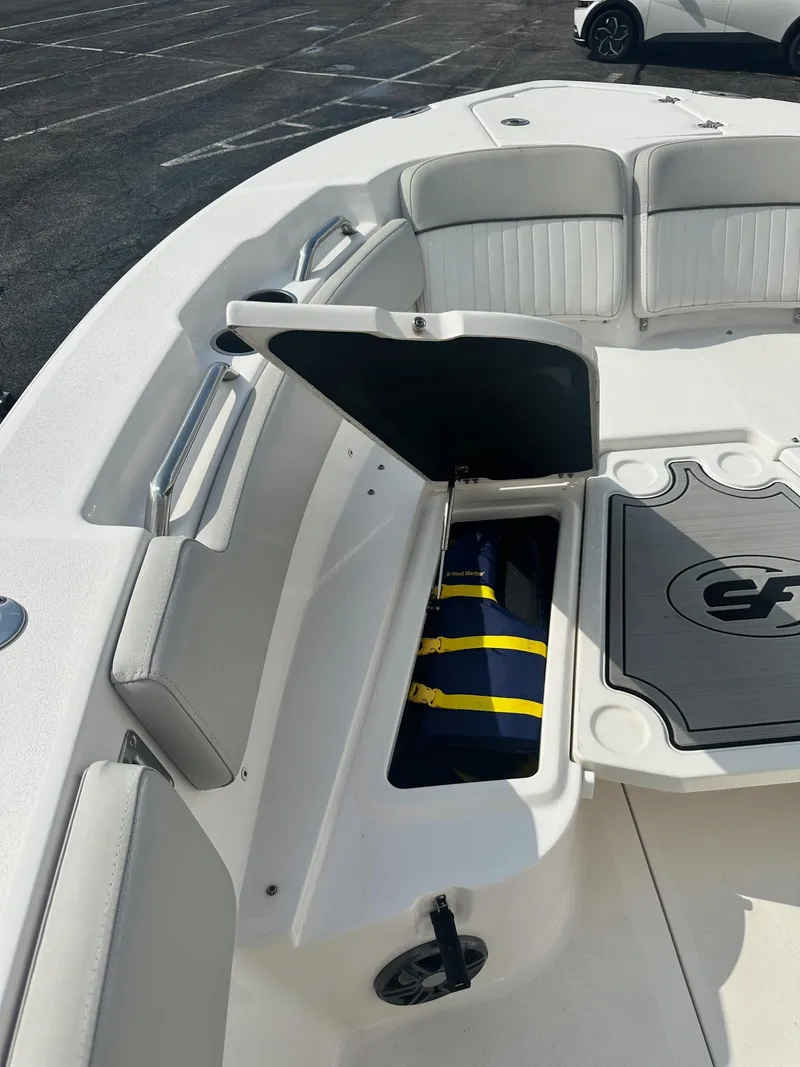 Slide: The Image of 2022 Sea Fox 248 Commander boat interior with open storage compartment. - 28