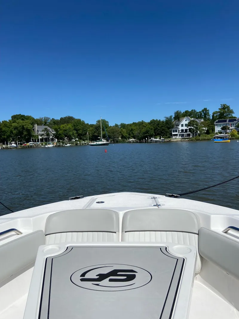 Slide: The Image of 2022 Sea Fox 248 Commander boat on a calm lake with clear blue sky. - 32