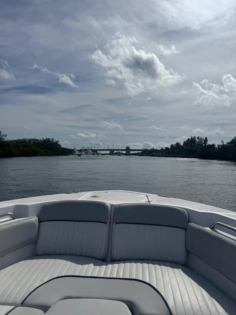 Slide: The Image of 2022 Sea Fox 248 Commander boat cruising on a calm river under a cloudy sky. - 33