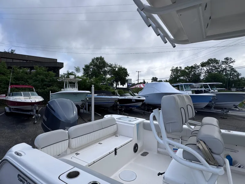 Slide: The Image of 2022 Sea Fox 248 Commander boat in a marina with other vessels. - 35