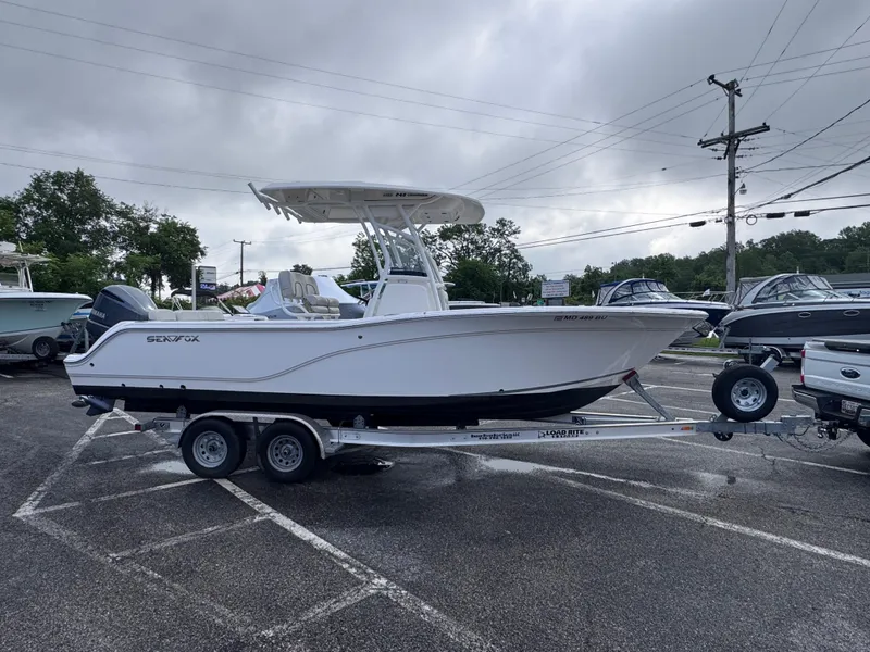 Slide: The Image of 2022 Sea Fox 248 Commander boat on trailer in parking lot. - 5