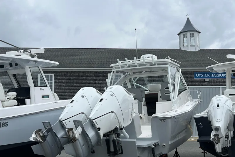 Slide: The Image of 2024 Albemarle 30 Express boat with dual outboard engines at Oyster Harbors Marine. - 11