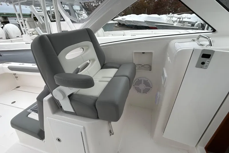 Slide: The Image of 2024 Albemarle 30 Express boat interior with gray seating and modern design. - 24